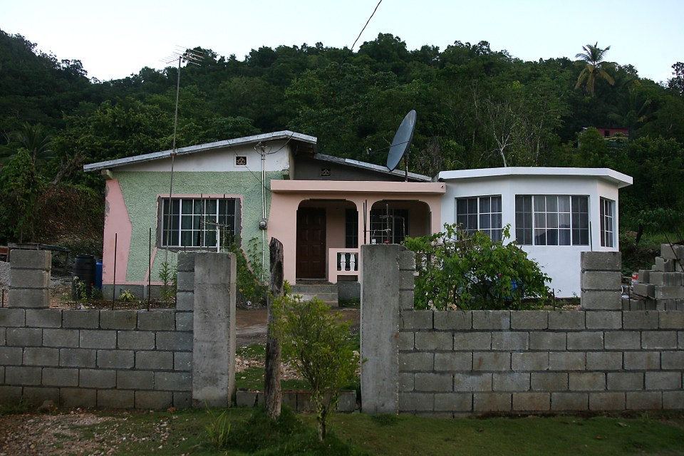 The pastel-painted single storey home Bolt once shared with his family in the remote Trelawny parish in Jamaica