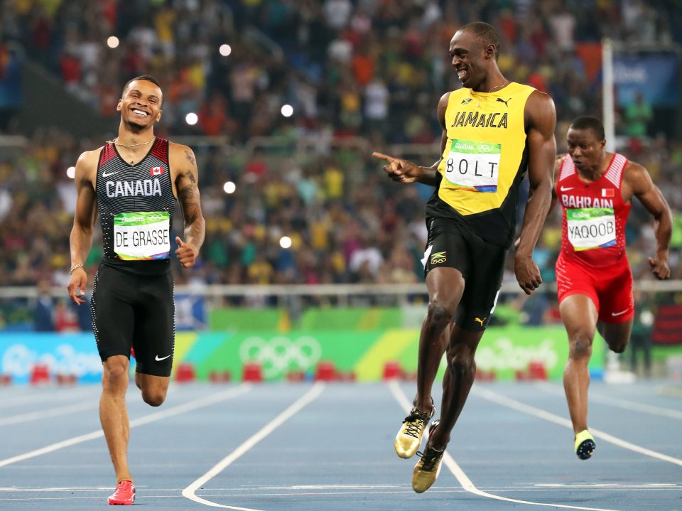 Bolt shares a joke with De Grasse after they both eased into the final