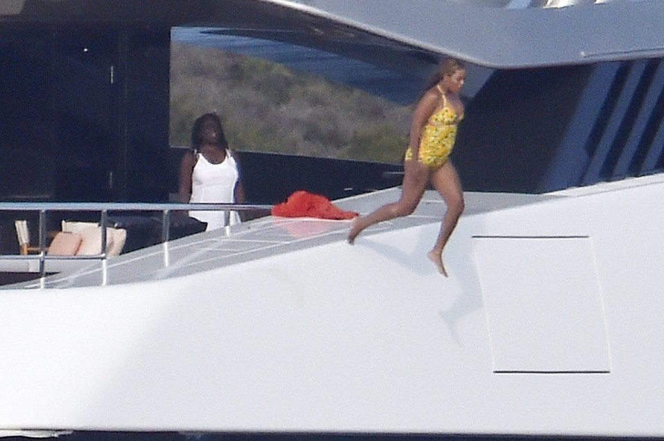 EXC - Singer Beyonce seen diving off mega Yach in Italy