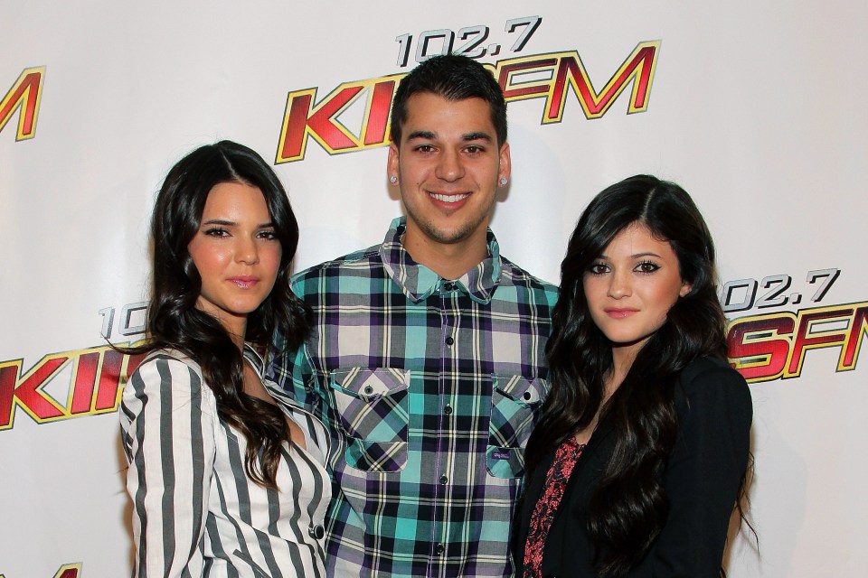 Kendall and Kylie have grown up in the public eye - pictured here with brother Rob 