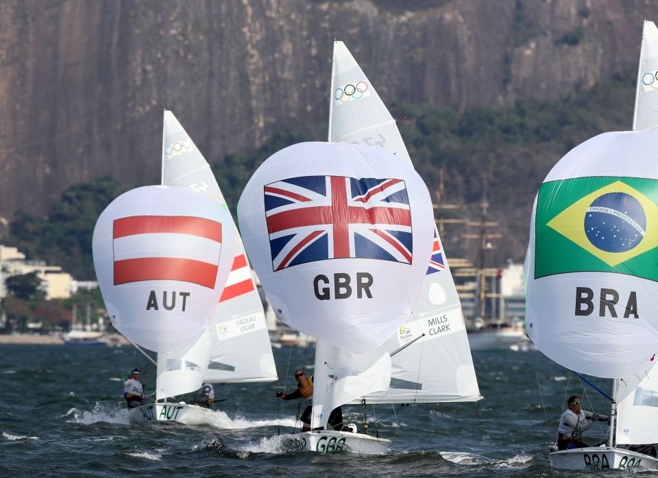 Hannah Mills and Saskia Clark sail to glory in front of Sugarcoat Mountain
