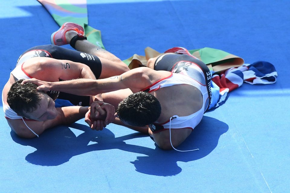 The siblings were overcome with emotion upon finishing and fell to the ground together