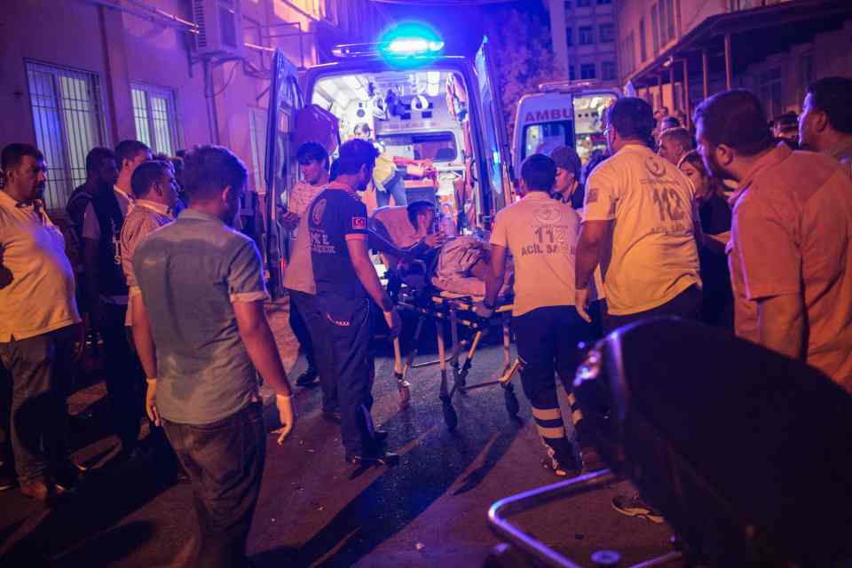 First aid officers carry an injured man
