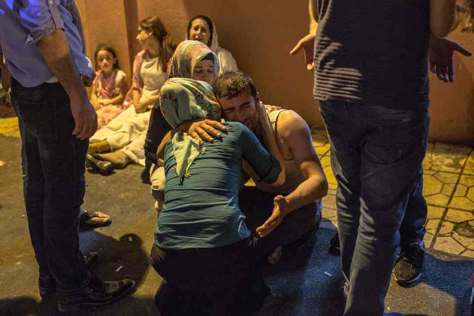 Relatives grieve at hospital August 20,