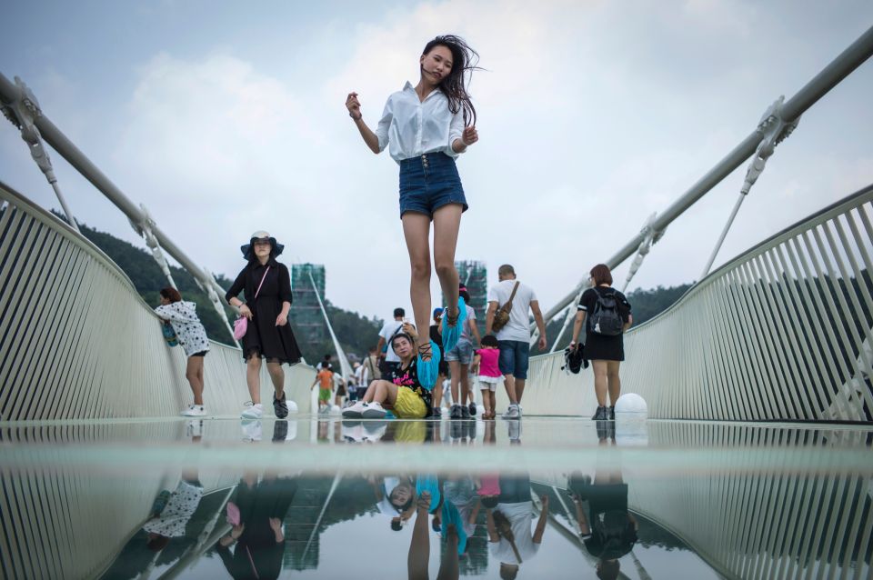 A visitor jumps for a photograph on the