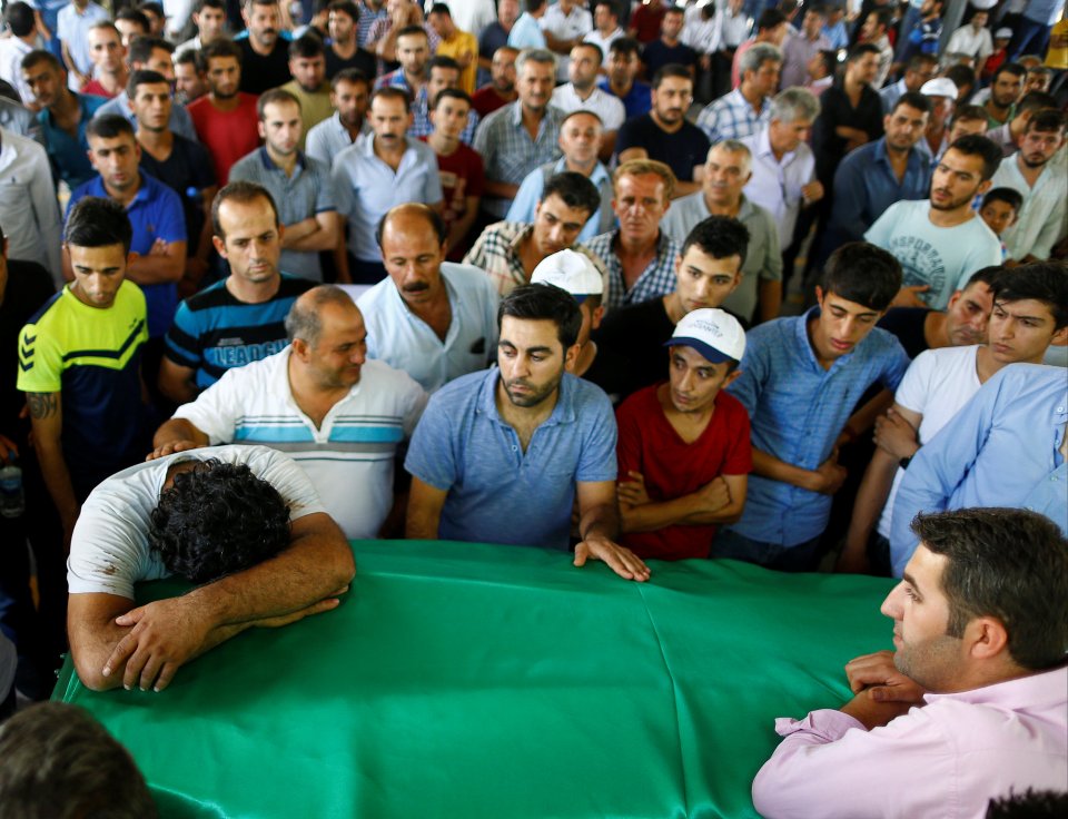 Hundreds of people gathered to mourn those killed in the suicide bombing