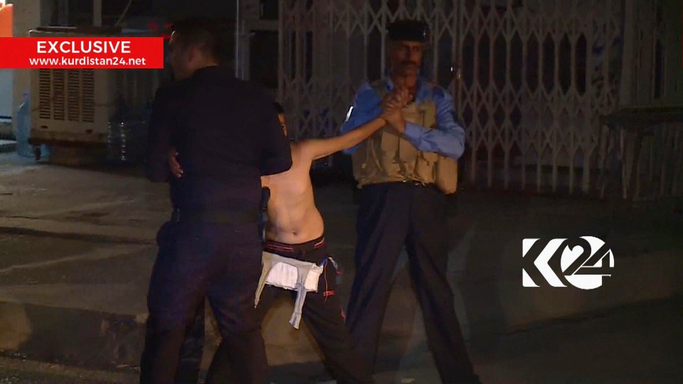 The officers carefully removed the vest from the boy as two held his arms away from any potential detonator