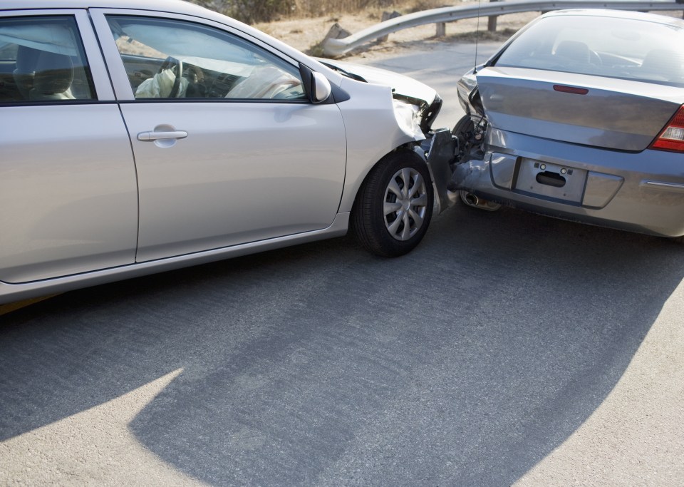 Two cars in collision on roadway