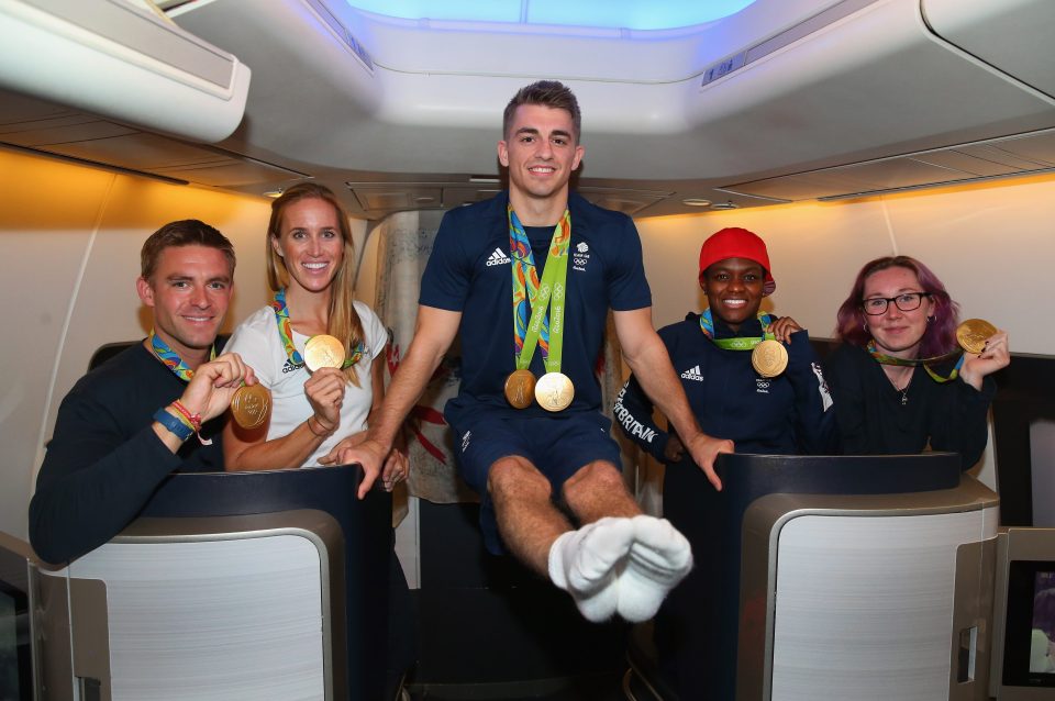 Max Whitlock performed a balancing act as the Team GB squad arrived in Heathrow after a triumphant Olympics