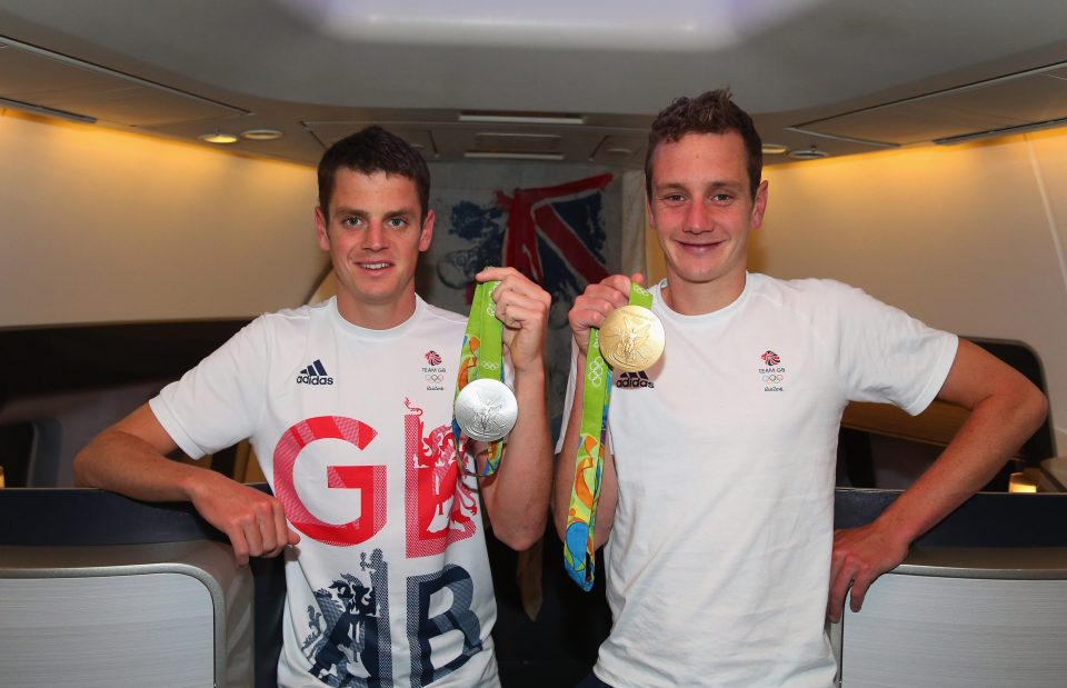 Jonathan and Alistair Brownlee show off their silver and gold medals from the triathlon