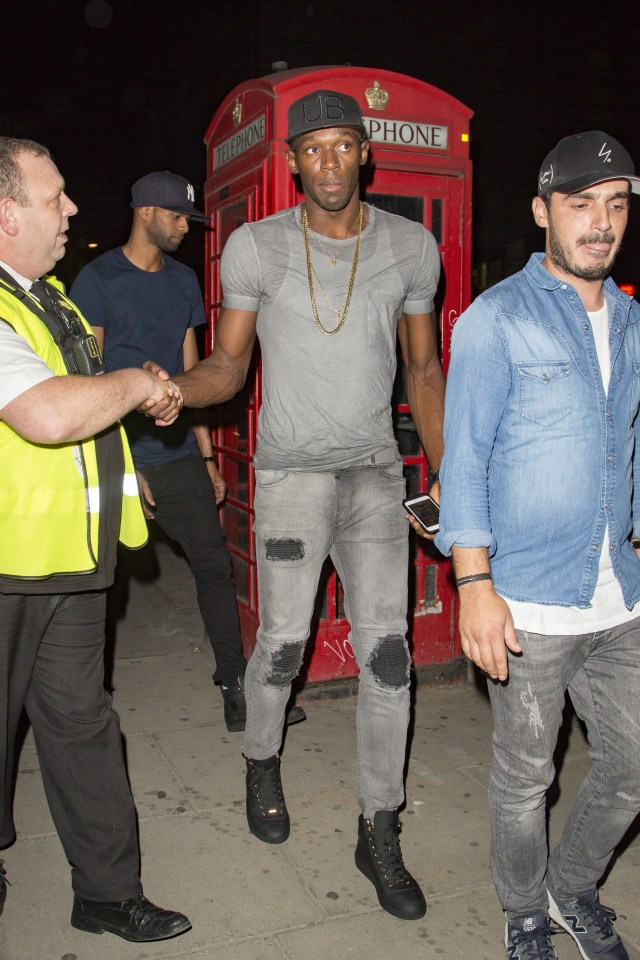 Security are eager to shake Usain Bolt's hand as he arrives in London