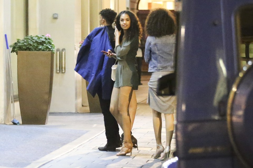 The girls get out of the taxi as they arrive at Usain Bolt's hotel