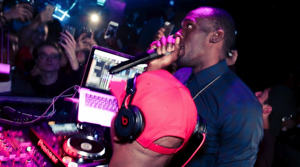 He got on the DJ mic behind the decks