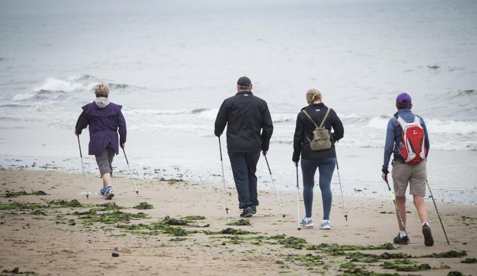 Nordic walkers on a wet Thursday morning at Saltburn on the North Yorkshire coast
