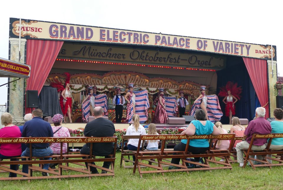 Cabaret acts dance to the music from the steam powered organs. 48th Great Dorset Steam Fair