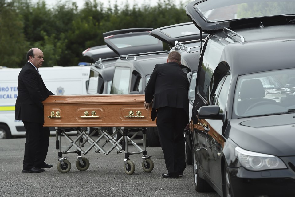 Undertakers removed several coffins from the home early this evening as police continued their investigation