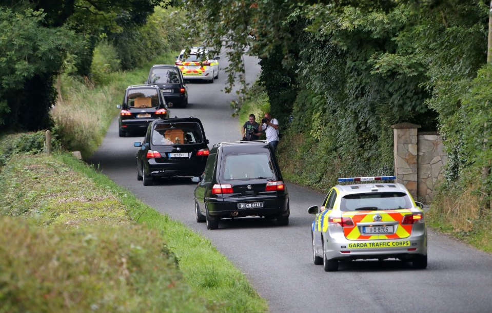A convoy of hearses leaves the scene under police escort in heartbreaking scenes emerging from Ireland this evening