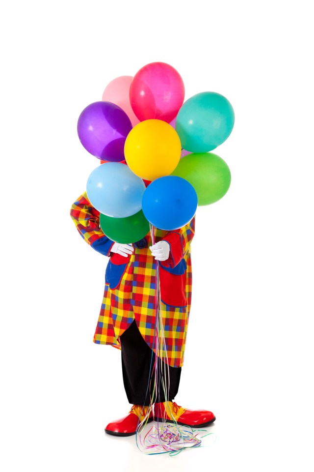 Clown holding ballons