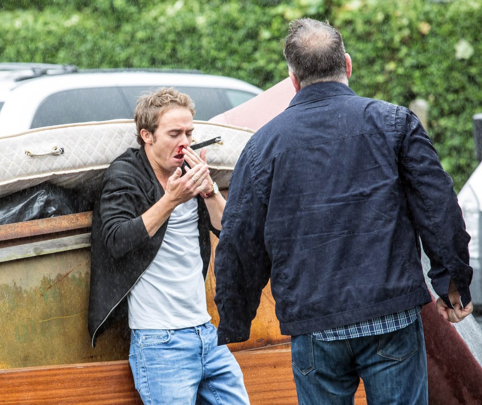 When David notices an update on Macca’s social media page that tells him the Dog and Gun are having a party for Clayton’s birthday in his absence, he storms down there determined to find Macca but before he can reach the pub he’s grabbed by a menacing figure
