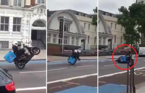 Domino's pizza driver who crashed while pulling a wheelie in front of howling crowd gets sacked