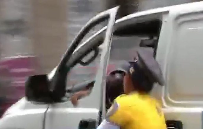 The cop was thrown to the ground when the driver tried to flee a traffic stop