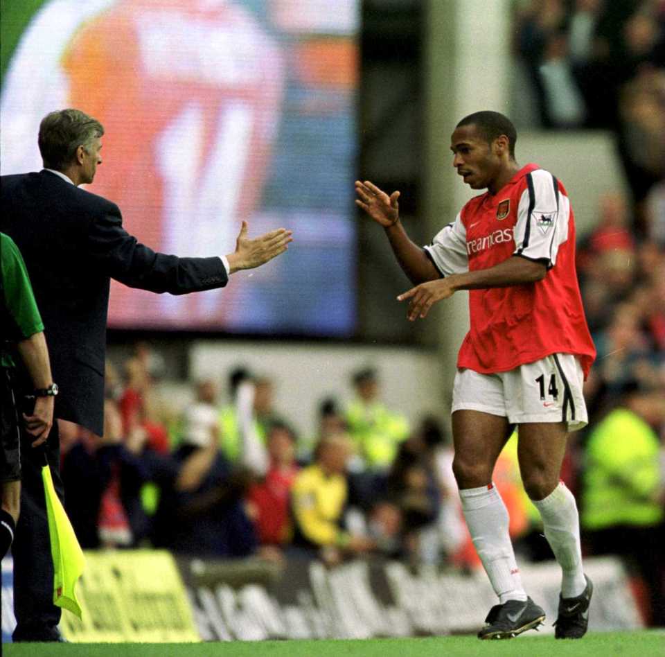 1 Oct 2000: Thierry Henry of Arsenal celebrates with manager Arsene Wenger after scoring during the FA Carling Premiership game between Arsenal and Manchester United at Highbury in London. Mandatory Credit: Graham Chadwick/ALLSPORT