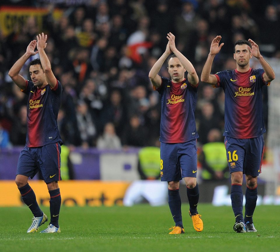MADRID, SPAIN - JANUARY 30: Xavi Hernandez (L), Andres Iniesta (2.L), Sergio Busquets and Jordi Alba of FC Barcelona applaud after drawing 1-1 with Real Madrid in the Copa del Rey semi final, first leg match between Real Madrid CF and FC Barcelona at Estadio Santiago Bernabeu on January 30, 2013 in Madrid, Spain. (Photo by Denis Doyle/Getty Images)