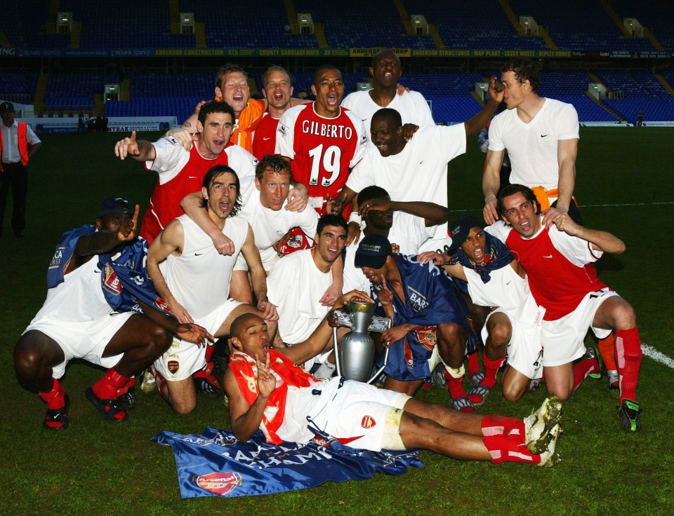 Arsenal celebrate clinching the 2004 title at home of arch-rivals, Tottenham