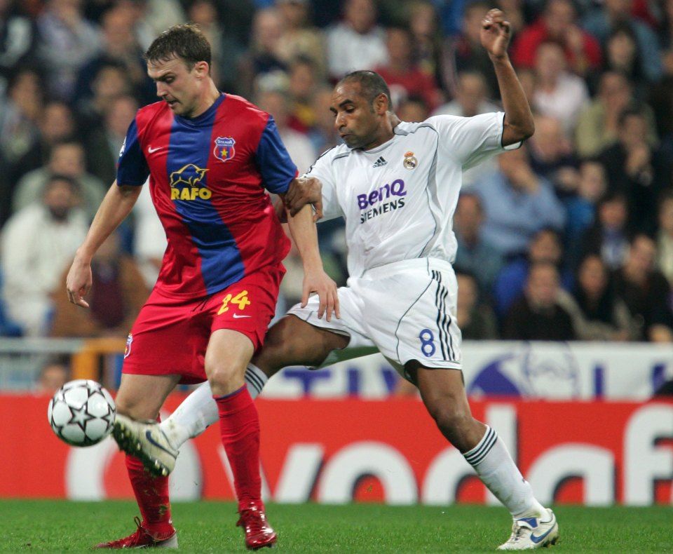 MADRID, SPAIN - NOVEMBER 01: Emerson (R) of Real Madrid vies for a high ball with Sorin Ghionea of Steaua Bucharest during the UEFA Champions League Group E match between Real Madrid and Steaua Bucharest at the Santiago Bernabeu stadium on November 1, 2006 in Madrid, Spain. Real won 1-0. (Photo by Denis Doyle/Getty Images)