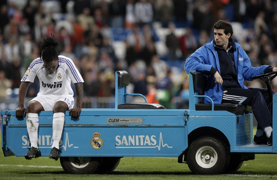 MADRID, SPAIN - APRIL 13: Royston Drenthe of Real Madrid is taken injured off the pitch at the end of the La Liga match between Real Madrid and Murcia at the Santiago Bernabeu Stadium on April 13, 2008 in Madrid, Spain. Real Madrid won the match 1-0. (Photo by Jasper Juinen/Getty Images)