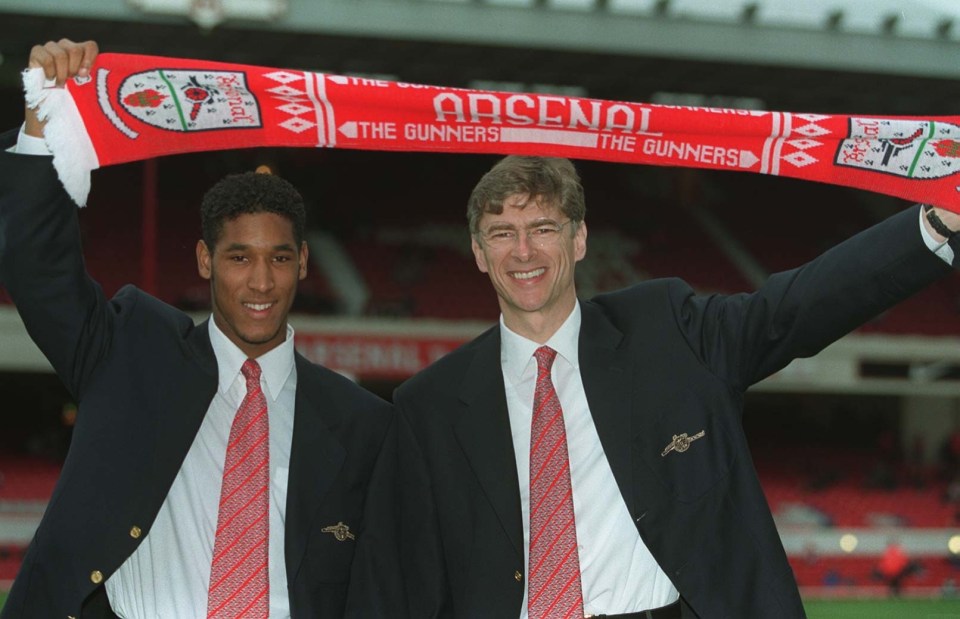 PIC RICHARD PELHAM 23.2.97. ARSENAL MANAGER ARSENE WENGER WITH NEW SIGNING NICOLAS ANELKA.