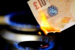 Gas ring flame burning a £10 note