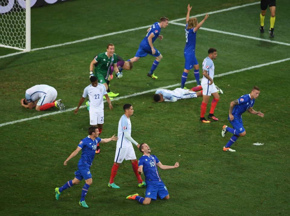 Iceland players celebrate while England players show dejection