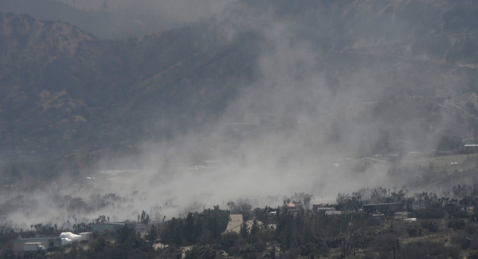 Heavy winds blow ash clouds in the burned out areas of the so-called Blue Cut Fire in the San Bernardino National Forest in San Bernardino County