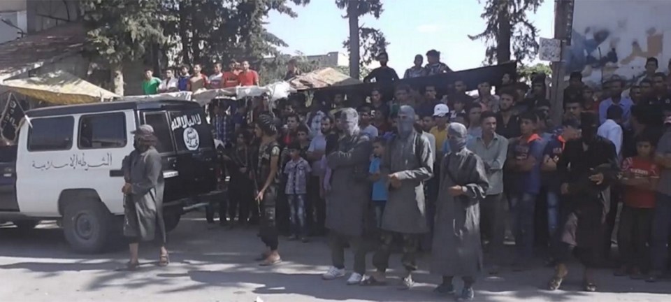 A bloodthirsty crowd watches on as the barbaric punishment is carried out to man accused of being a thief