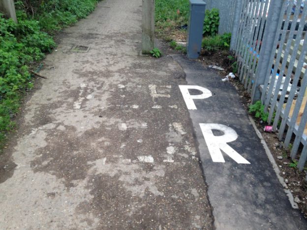 Job half done ... the words “Keep Clear” have only the P and R painted after a section of pathway near Marriott’s Way, Norwich