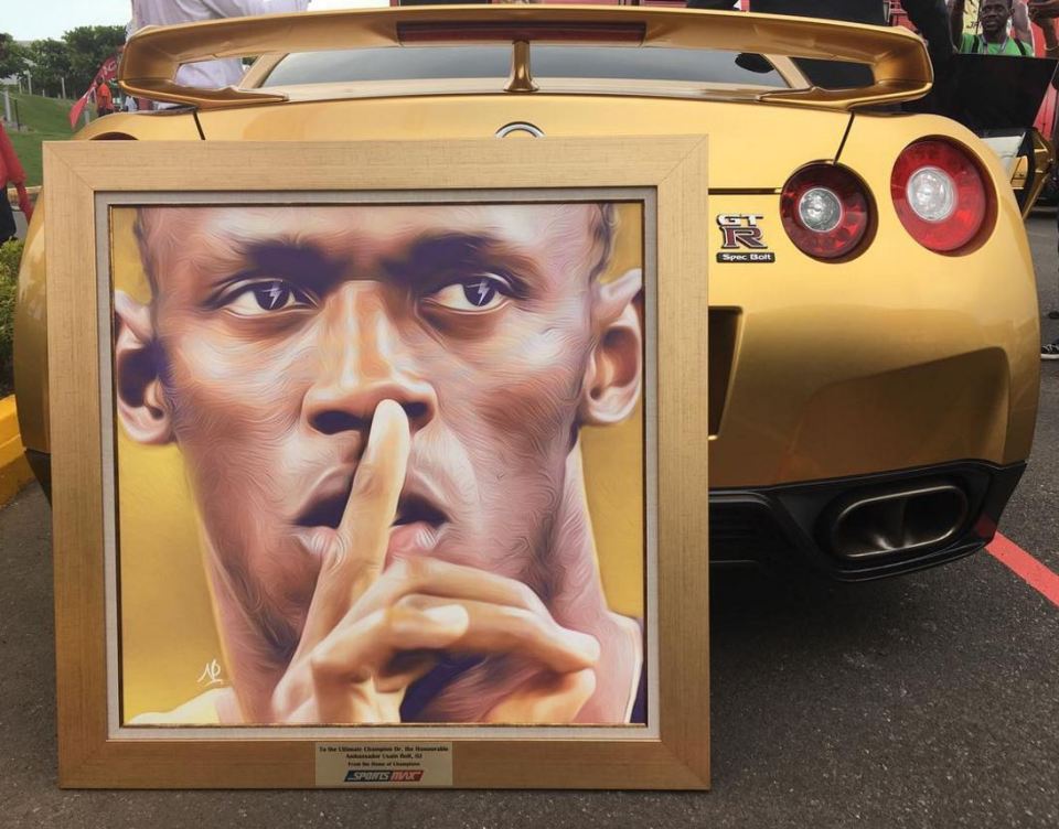 Bolt was also presented with a framed portrait with a gold frame