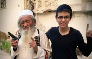 83-year-old Chinese geriatric jihadi poses with grandson while doing ISIS salute