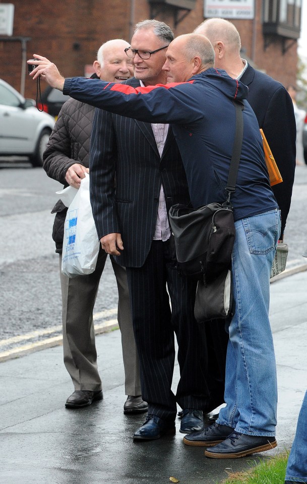 He posed for a series of selfies with fans on his way into Court