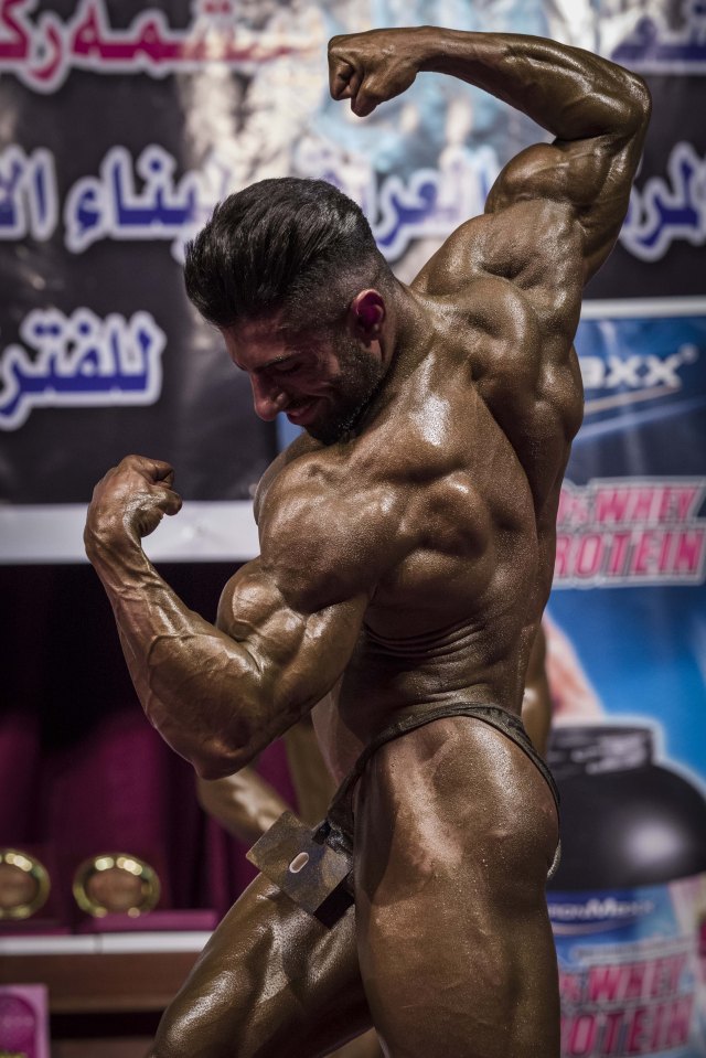 A competitor strikes a pose for the judges