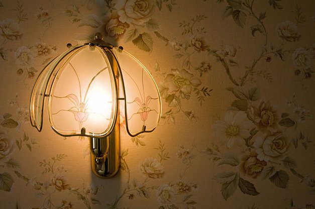 Decorative wall light illuminated at night