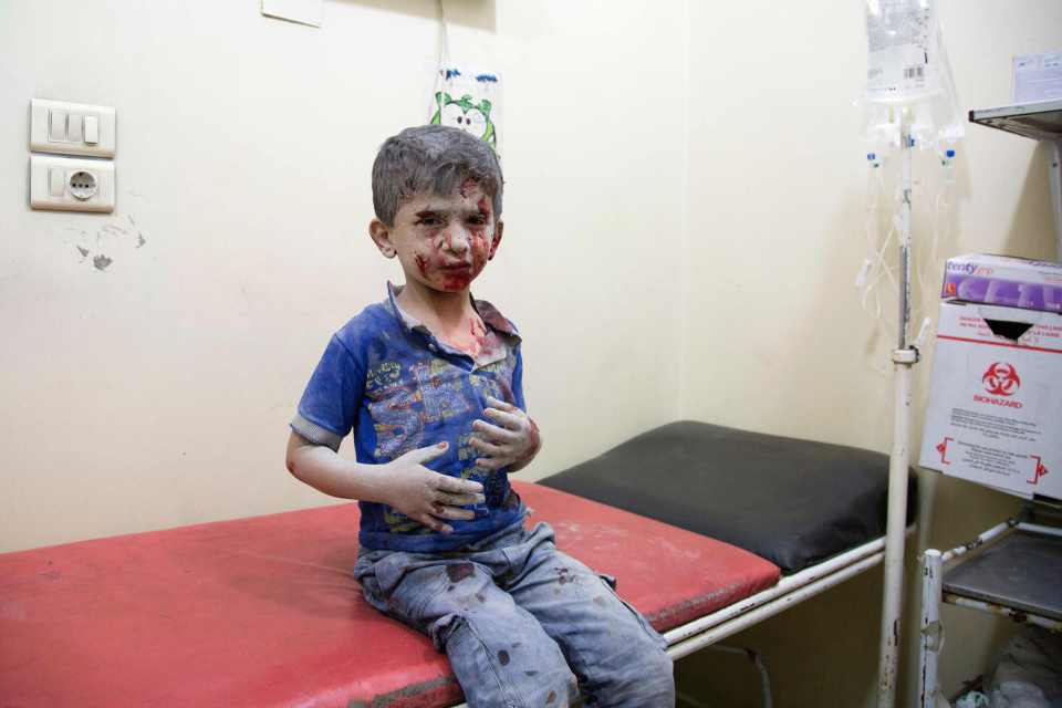 A Syrian boy awaits treatment at a make-