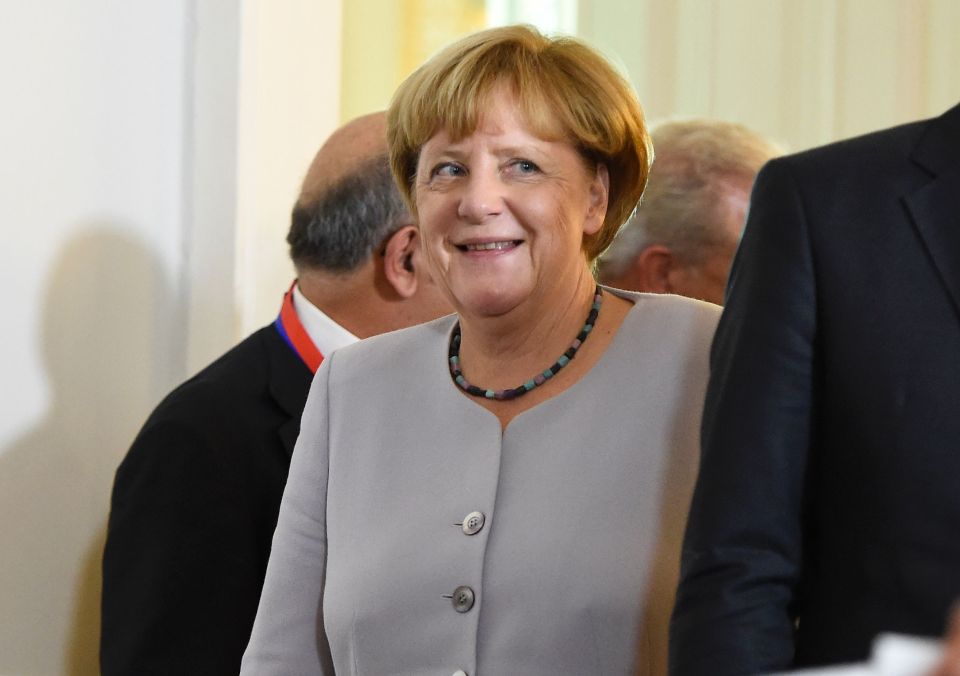 German Chancellor Angela Merkel smiles a