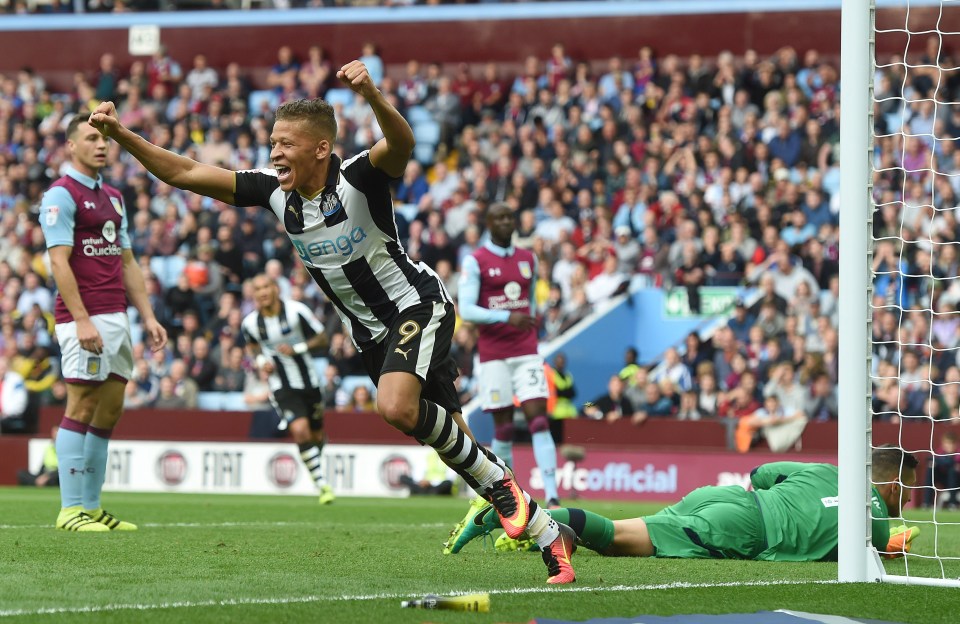 Dwight Gayle celebrates Tommy Elphick's own goal