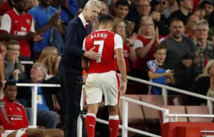 Arsenal manager Arsene Wenger congratulates his outstanding striker Alexis Sanchez after he destroyed Chelsea