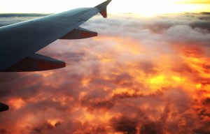 Plane passenger captures stunning sunset snap that looks like the clouds are burning