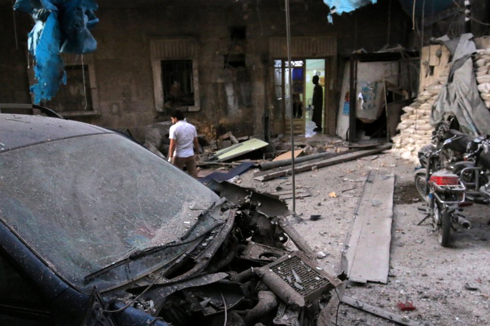 Medics inspect the damage outside a field hospital after an airstrike in the rebel-held al-Maadi neighbourhood of Aleppo