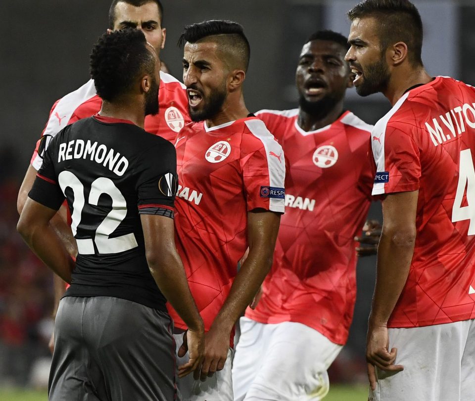 Redmond clashes with Hapoel Be'er Sheva's Miguel Vitor