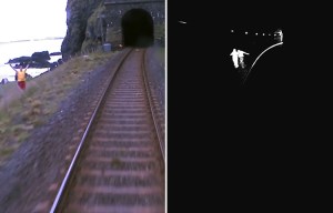 Shocking moment a lifeguard tries to wave down 90mph train speeding towards two people in dark tunnel