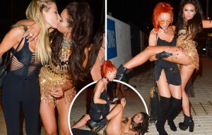 Charlotte Dawson is pictured kissing a girl and flashing her pants in Ibiza